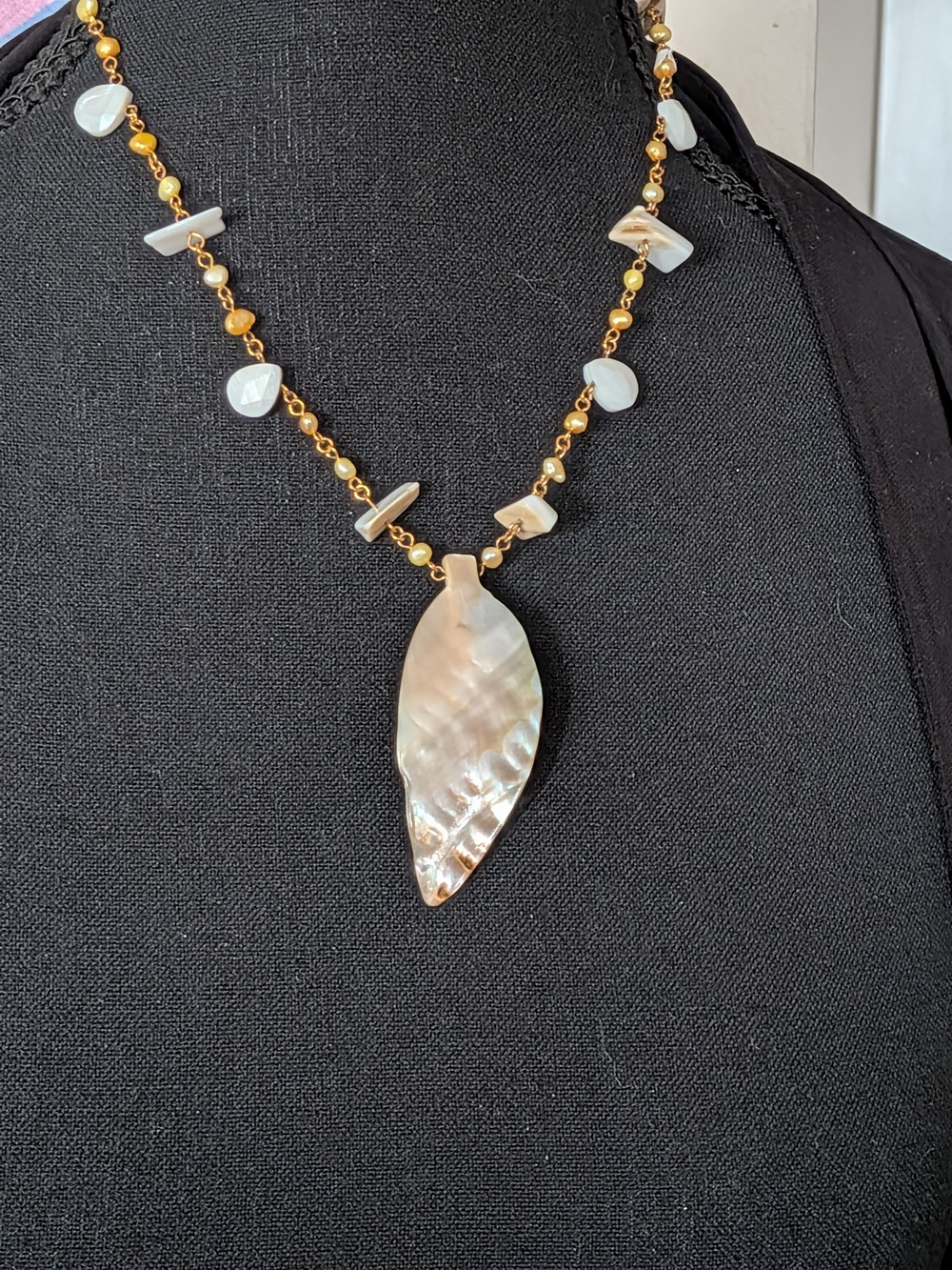 Gold Beaded Necklace with Mother-of-Pearl Leaf Pendant